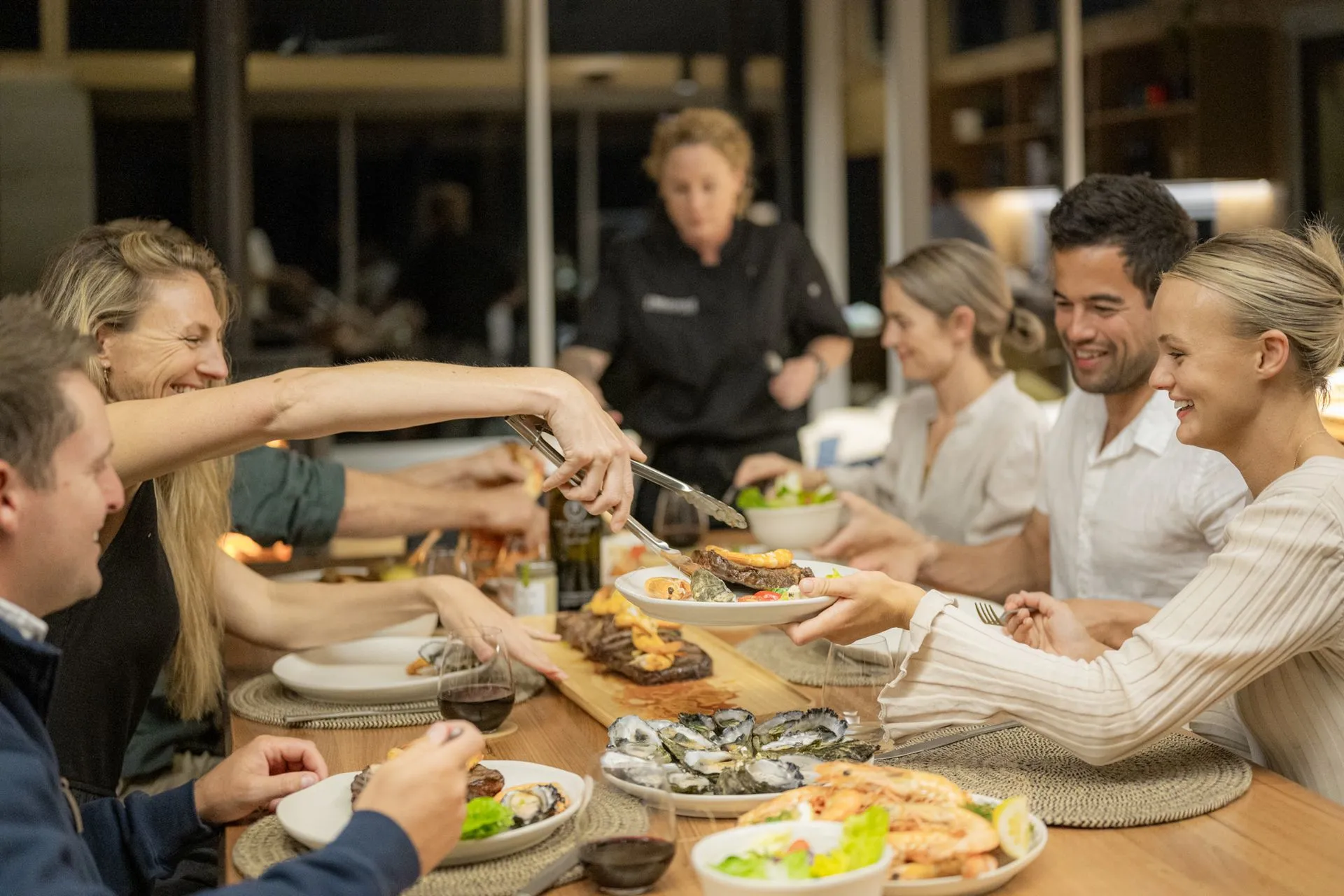 Guests sharing an Elements by Immerse dinner at the long table