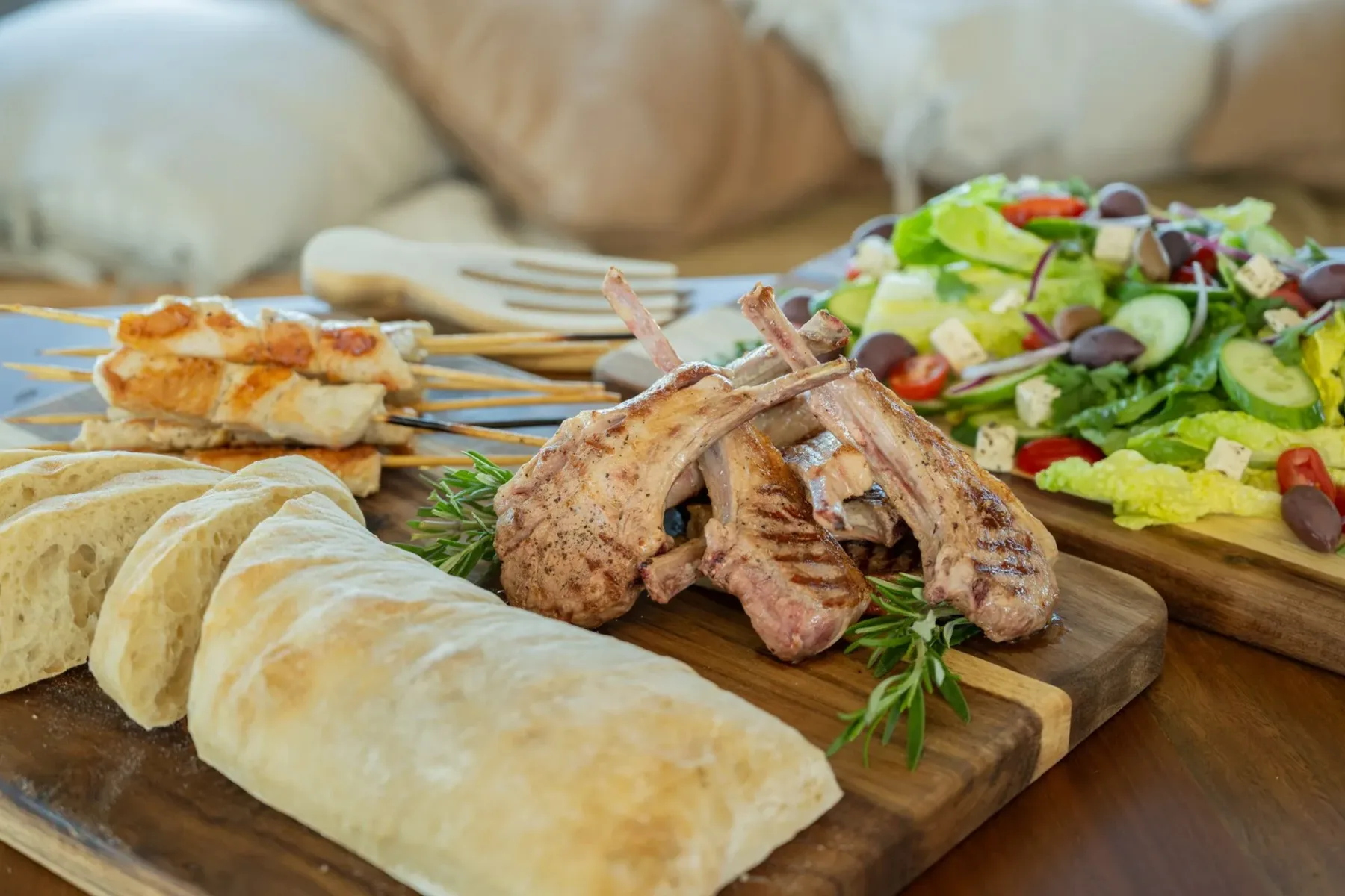 Barbecue hamper with lamb cutlets, chicken skewers, Greek salad and ciabatta